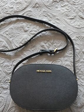 Michael Kors Black Oval Crossbody with Gold Hardware